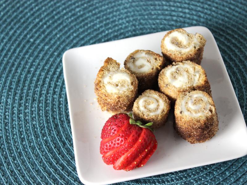 small white plate with five cinnamon swirl treats