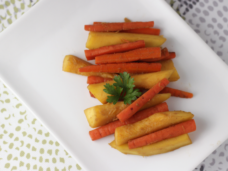 spiced carrots and squash recipe served on a white plate