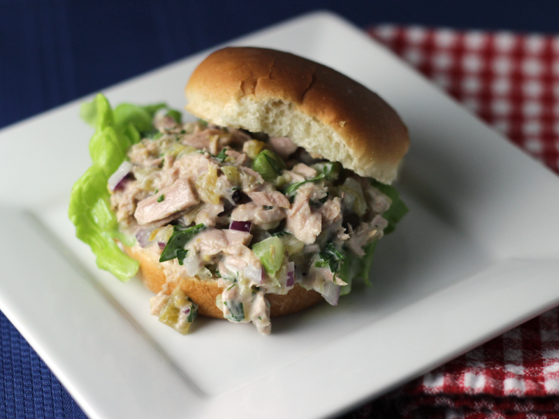 tuna slider sandwich with green chiles served on a white plate