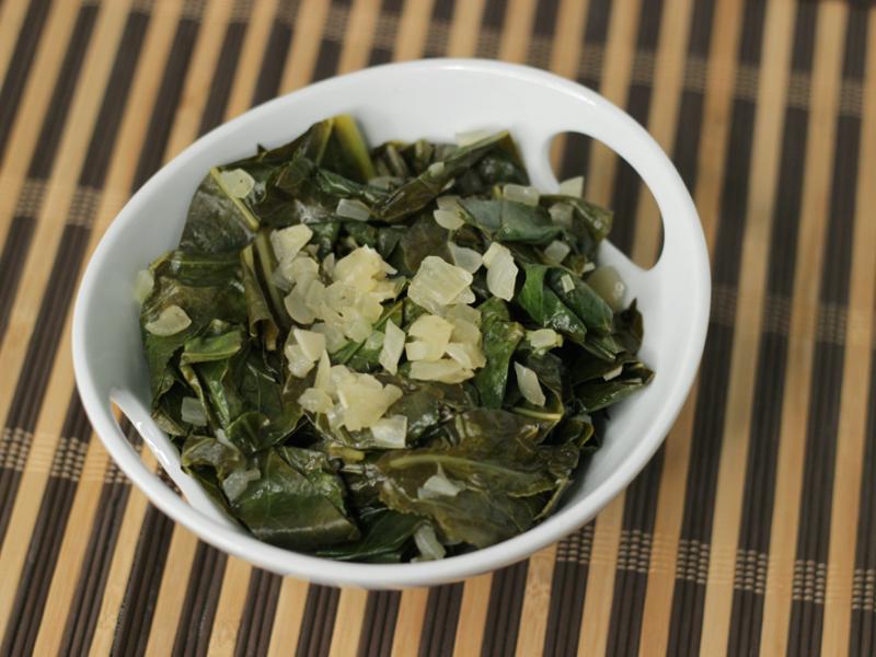 cooked collard greens in a white bowl