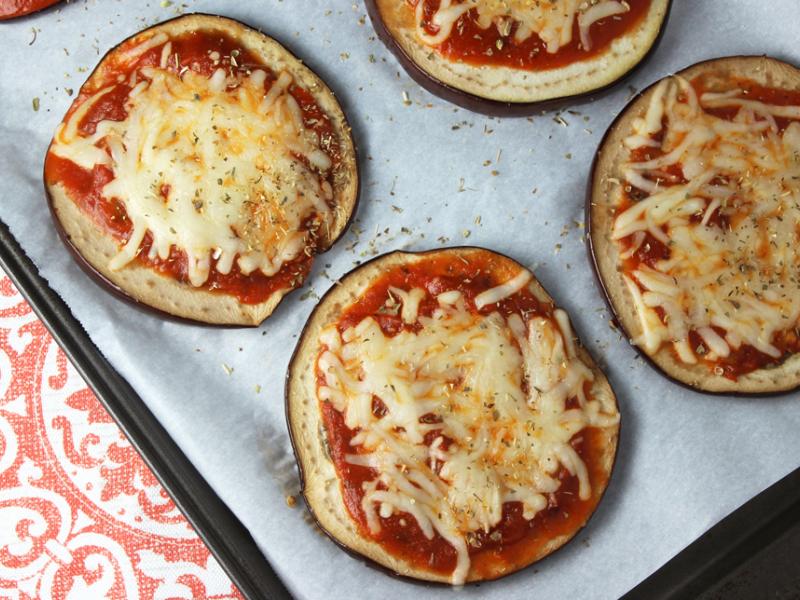 Four Eggplant Pizza Snacks on a baking sheet