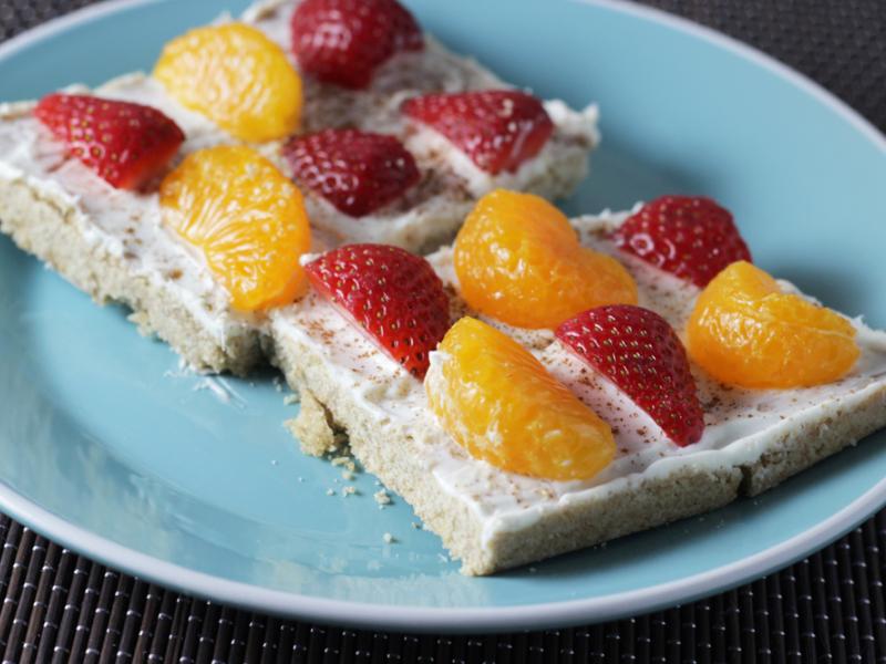 two slices of Favorite Fruit Pizza on a blue plate