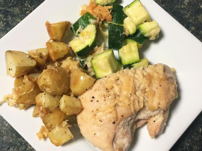 serving of Garlic Chicken, Potato, and Zucchini Sheet Pan Dinner on a white plate