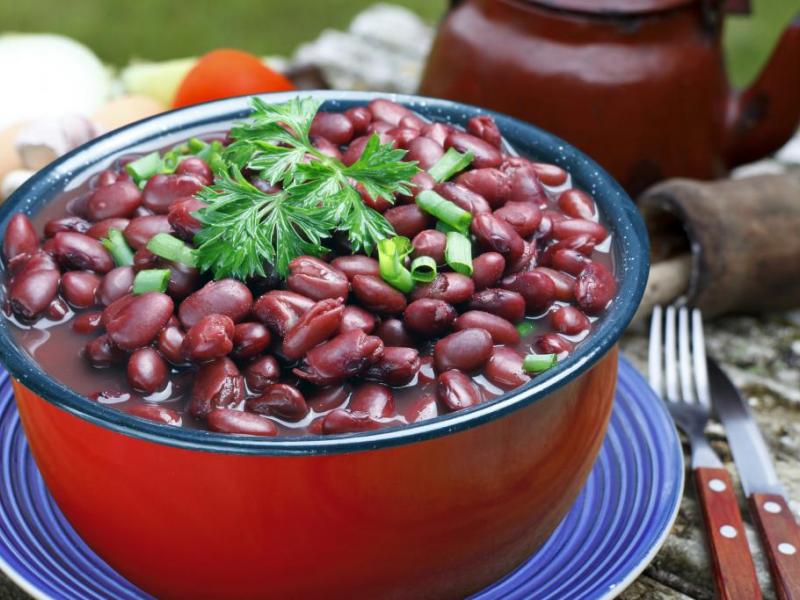 bowl of cooked red beans in a red bowl