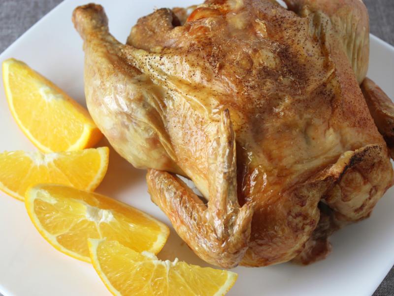 whole Oven Roasted Chicken on a white plate