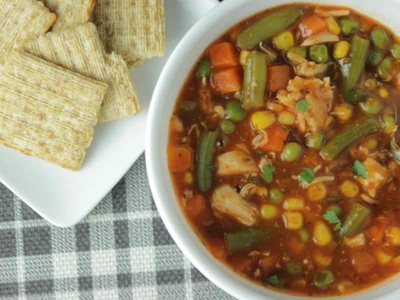 quick vegetable soup in a bowl with crackers on the side