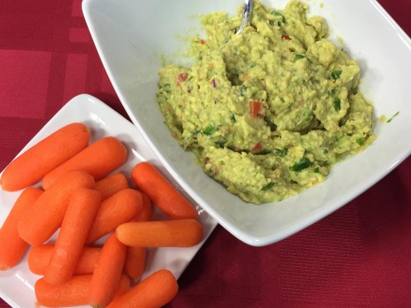 guacamole served with carrot sticks