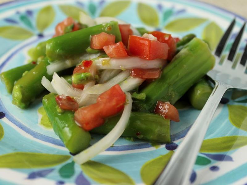 marinated asparagus recipe served on a blue green plate