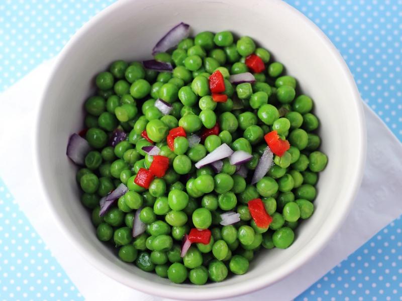 pea salad in a white bowl