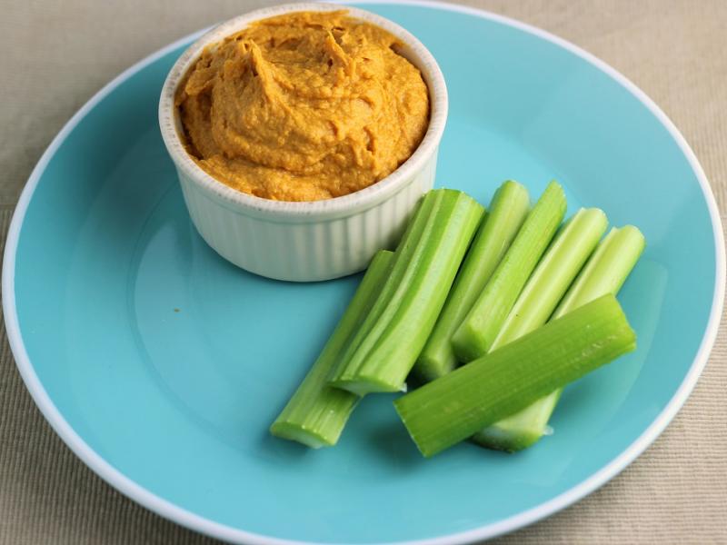 Pumpkin Peanut Butter Dip served with celery sticks