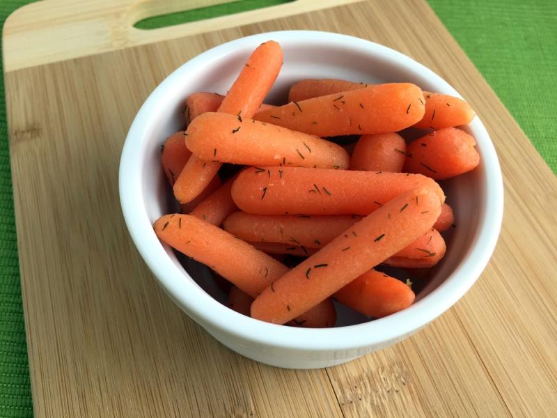 Sweet and Dilly Carrots on a white bowl