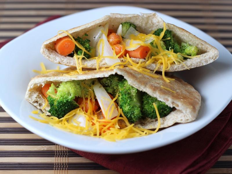 two Veggie Stuffed Pitas on a white plate