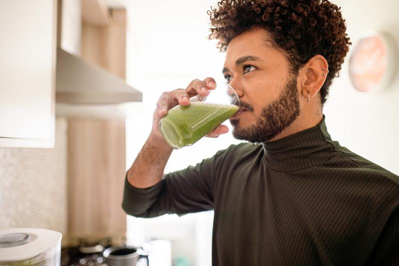 man drinking smoothie