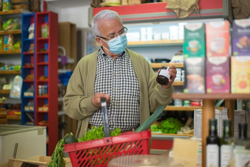 Man picking out canned food